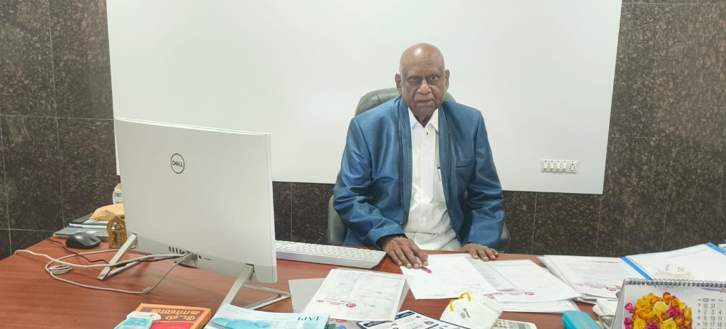 Chief physician at consultation desk