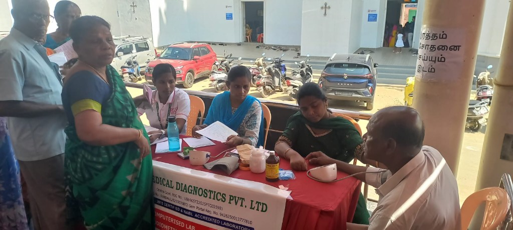 Blood pressure screening at a community medical camp