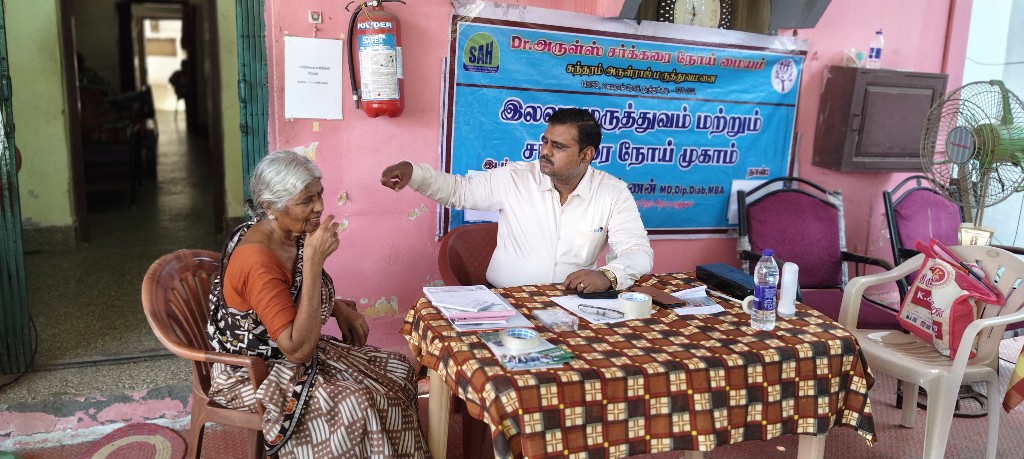 Patient consultation at a free neurology medical camp