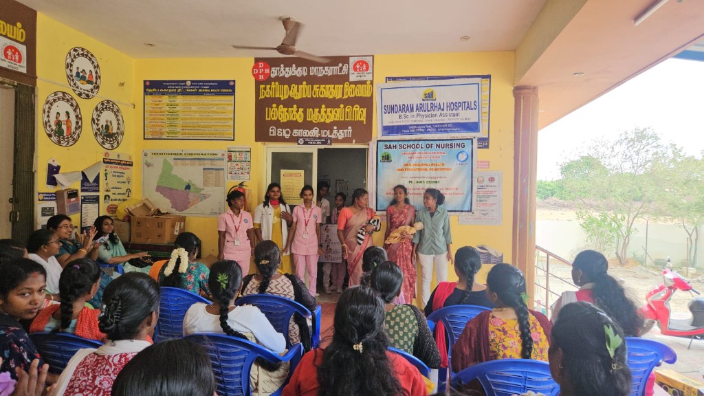Infant care demonstration at a public health education session